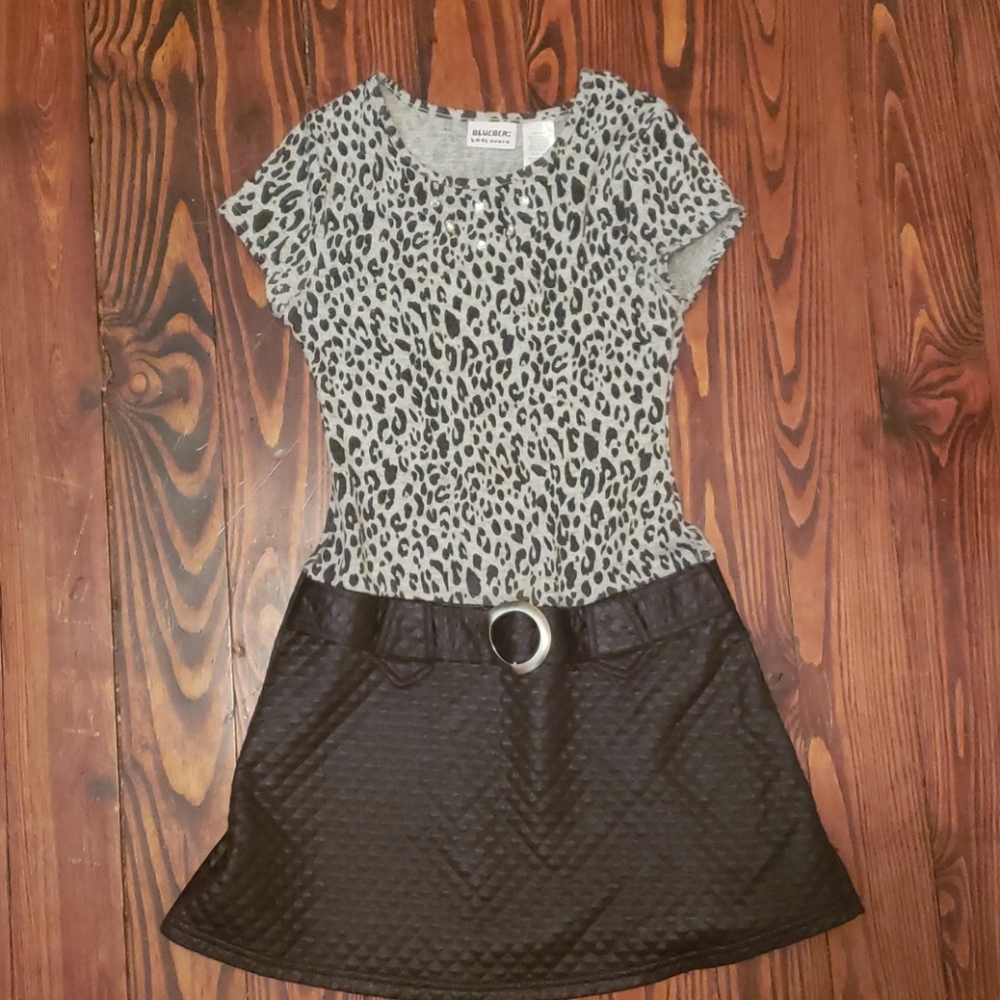 A cheetah print and black leather dress